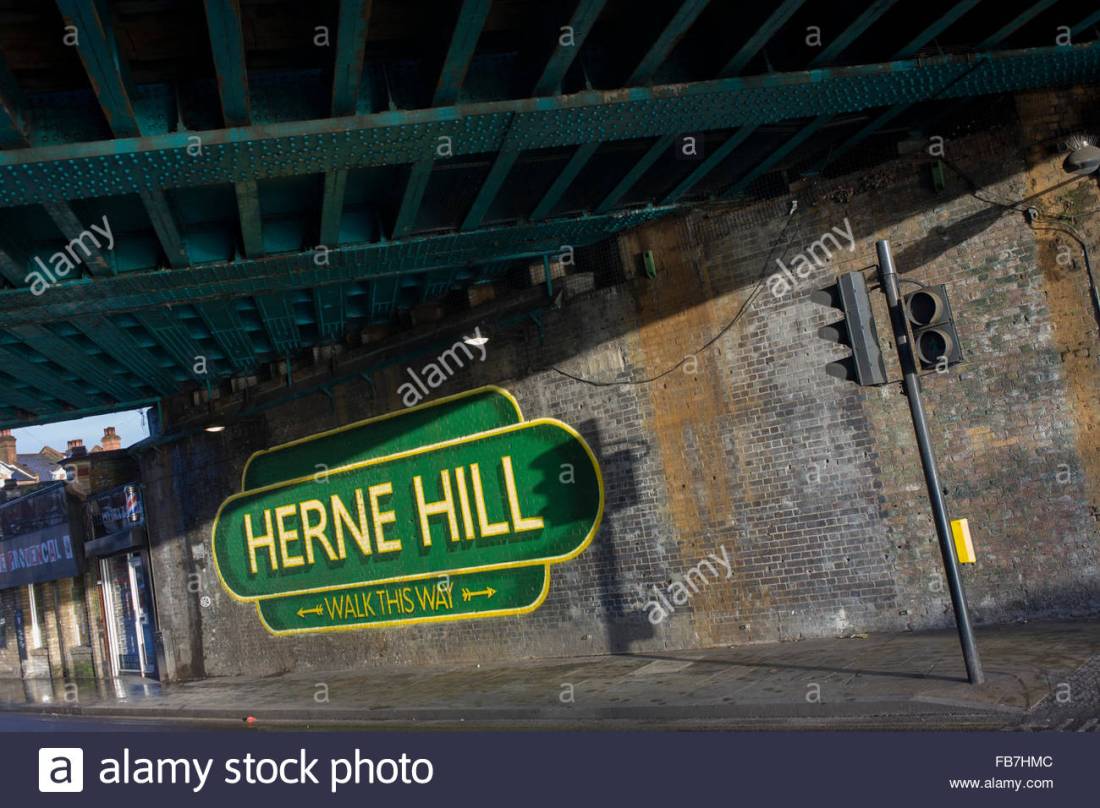 old-railway-style-sign-under-railway-bridge-in-herne-hill-south-london-FB7HMC