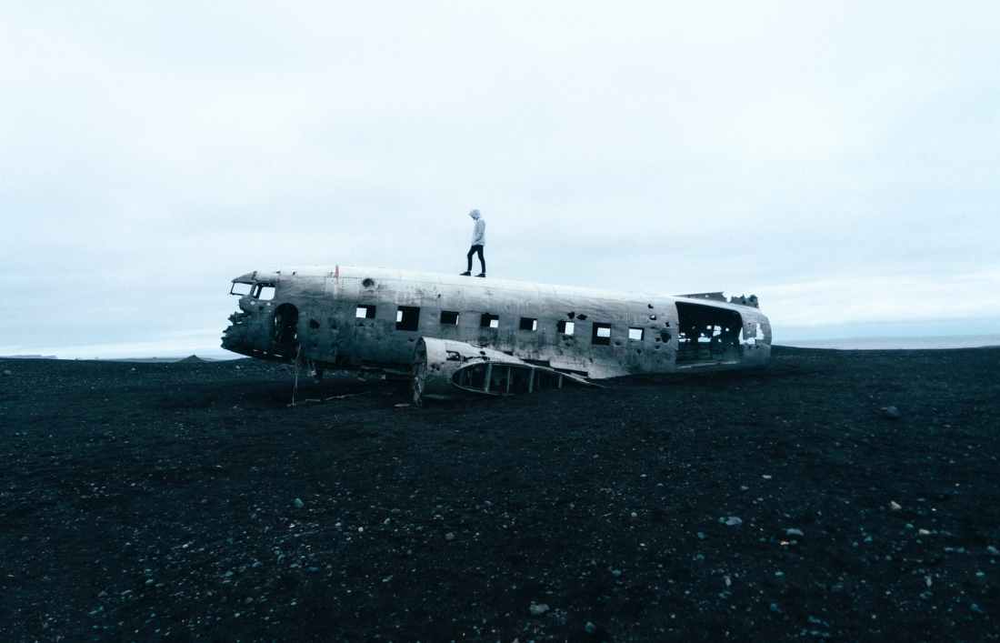 person standing on wrecked plane