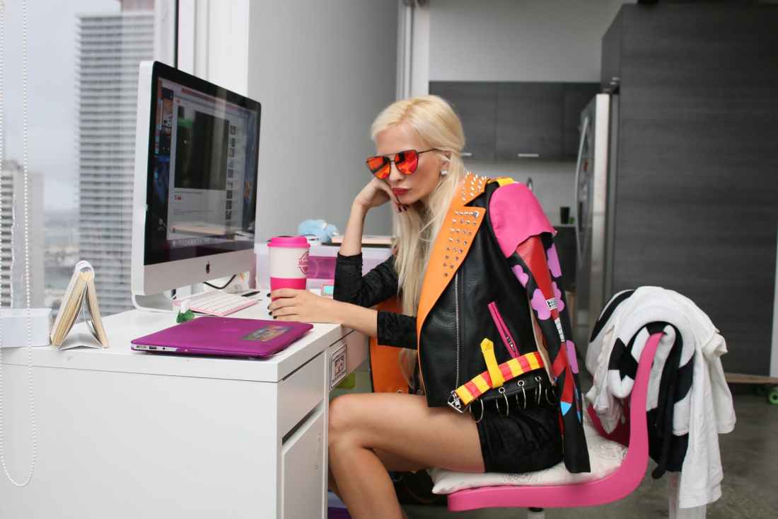 woman wearing black and orange leather jacket