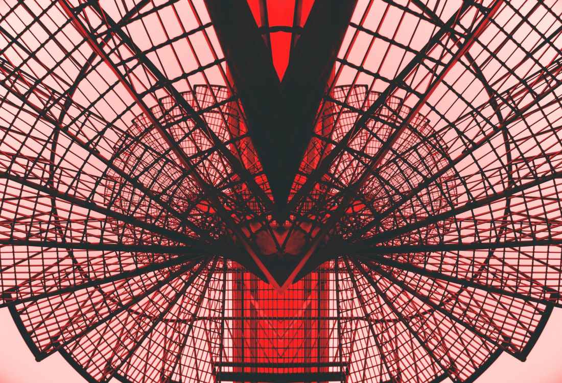 low angle photography of red metal tower